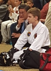 Master Brown encouraging a student at a tournament.